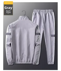 Vue arrière du survêtement réfléchissant gris pour homme avec bandes latérales blanches