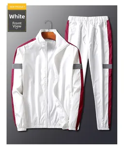 Détail du survêtement blanc avec empiècements rouges et gris et fermeture éclair frontale
