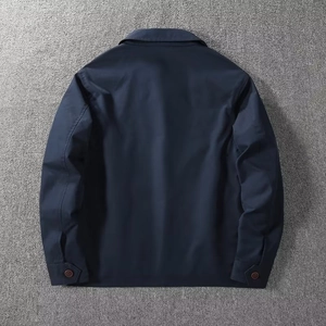 Detail view of the back of a navy business casual jacket with premium fabric texture