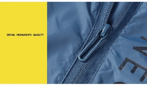 Detailed macro shot of indigo blue ripstop fabric and high-quality zipper on sun jacket
