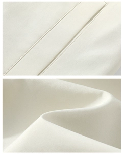 Macro shot of durable white fabric texture and precision stitching on casual jacket set