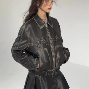 Women's black PU leather jacket with white contrast stitching and bow details