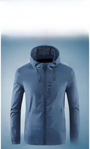 Close-up of lightweight blue sun protection jacket with hood and elastic cuffs