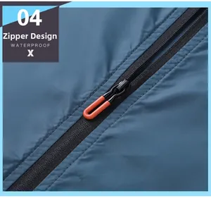 Detail of waterproof outdoor jacket featuring a premium black zipper with orange puller