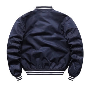 Rear view of navy bomber jacket featuring classic black and white striped ribbed cuffs