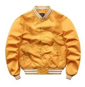 Detail of yellow bomber jacket featuring white striped ribbed collar and snap button closure