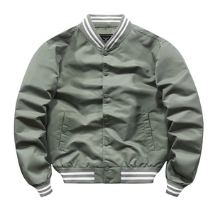 Detailed view of striped ribbed cuffs and sage green satin fabric on bomber jacket