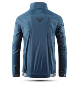 Detail of navy outdoor sun protection jacket with BUILT FREE logo and freedom elastic hem