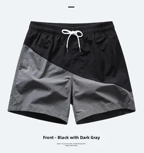 Detail of men's beach shorts with black and dark grey stitching and adjustable drawstring