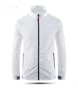 Detail view of white stand collar sun protection jacket with orange zipper accents