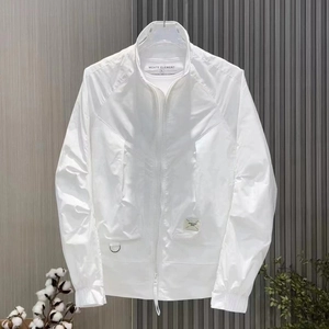 Detail of white men's jacket featuring a stand collar zipper and metal D-ring accent