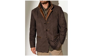 Detailed close-up of a retro men's brown jacket with contrast leather trimming and collar