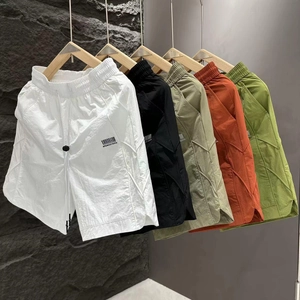Detail view of quick-dry men shorts in five colors with elastic drawstring waistbands