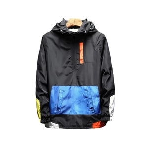 Black hooded windbreaker jacket with blue pocket and colorful geometric splicing details