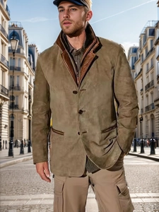 Detail of vintage olive green suede jacket with dark brown leather contrast collar