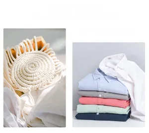 Detail shot of multi-color cotton hemp shirts stacked neatly showing fabric texture