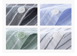Close-up of striped cotton shirts showing oxford texture and resin buttons in four colors