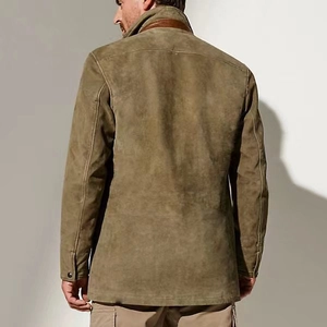 Detail of the men's vintage olive jacket featuring a brown leather collar and sturdy canvas texture