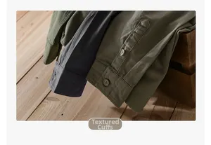 Close-up of durable cotton twill shirt cuffs with buttons on a rustic wood background