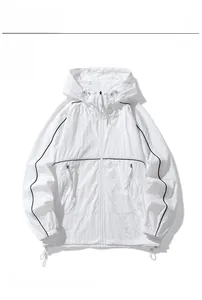 Detail view of white hooded sunscreen jacket with black contrast trim and zipper pockets