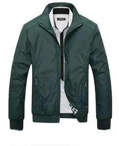 Detail of dark green stand collar jacket with ribbed cuffs and secure zipper pockets