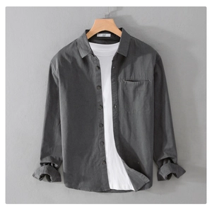 Detailed macro view of dark grey long sleeve shirt fabric texture and large size label