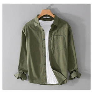Detail of olive green heavy cotton shirt with chest pocket and front button closure