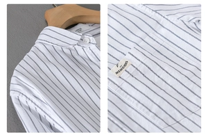 Detailed view of the striped cotton shirt collar and chest pocket with decorative label