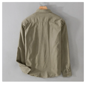 Detail view of khaki work shirt featuring a classic back yoke and durable cotton fabric