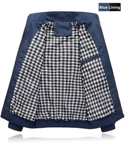 Detail of navy windproof jacket featuring classic black and white plaid cotton lining and inner pocket