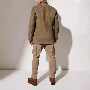 Mens vintage olive green utility jacket with khaki cargo pants and brown boots