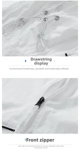 Macro detail of white sun protection jacket featuring adjustable drawstring and zipper