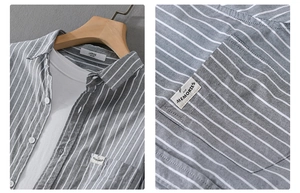 Detail view of grey vertical stripe cotton shirt featuring an embroidered pocket label