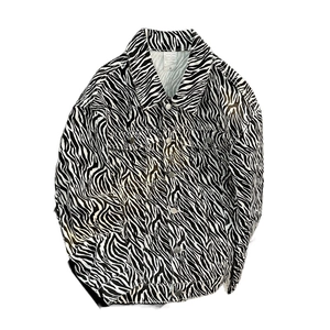 Men's zebra print denim jacket in loose fit featuring classic black and white stripes