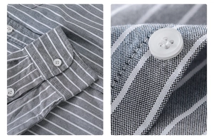 Detail of grey striped cotton shirt showing oxford fabric texture and white buttons