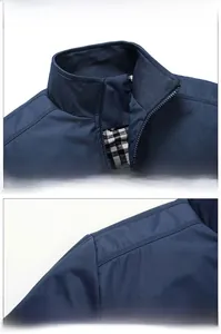 Detail of navy blue men jacket featuring a stand-up collar and black-white checkered lining