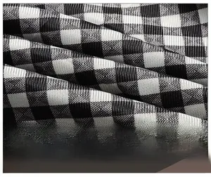 Macro shot of breathable black and white checkered fabric lining for men's casual jackets
