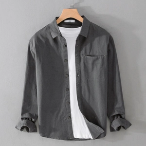 Men's dark grey long sleeve casual shirt with chest pocket and white t-shirt layering