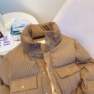 Short khaki winter puffer jacket with stand collar and diagonal quilted texture