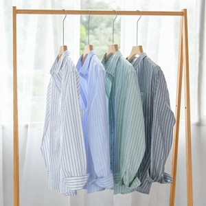 Classic men striped long sleeve casual shirt in four colors on wooden hangers