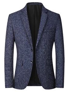 Close-up detail of slim fit men's blazer with textured fabric and notch lapels