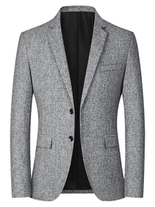 Detailed view of men's slim fit grey blazer with textured fabric and classic lapel