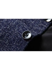Macro view of navy blue textured fabric with premium engraved buttons on men's slim blazer