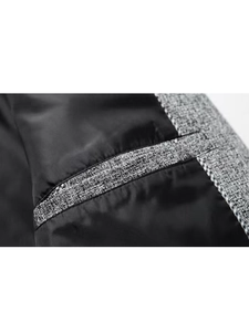 Detail of slim fit blazer inner pocket featuring smooth lining and textured trim sewing