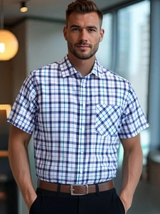 Detail of blue plaid pattern on men's short sleeve shirt with chest pocket