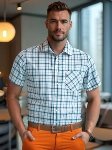 Close-up of a men's short-sleeved plaid shirt with a classic collar and chest pocket detail