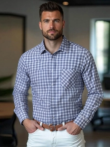 Detail of blue and grey plaid men's business shirt with classic collar and chest pocket