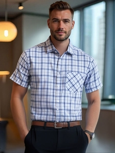 Close-up of blue plaid short sleeve shirt featuring classic collar and chest pocket