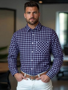 Close-up of blue plaid men's business shirt with diagonal patterned chest pocket