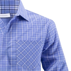 Close-up of blue plaid shirt featuring a classic pointed collar and diagonal chest pocket
